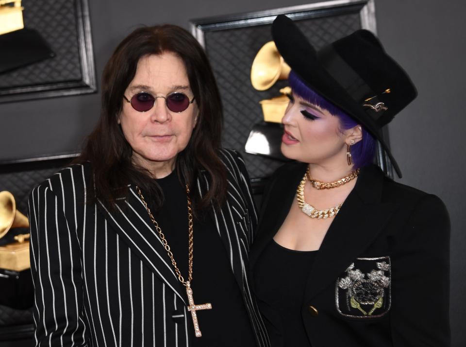 British singer-songwriter Ozzy Osbourne and his daughter Kelly Osbourne arrive for the 62nd Annual Grammy Awards on January 26, 2020, in Los Angeles. (Photo by VALERIE MACON / AFP) (Photo by VALERIE MACON/AFP via Getty Images)