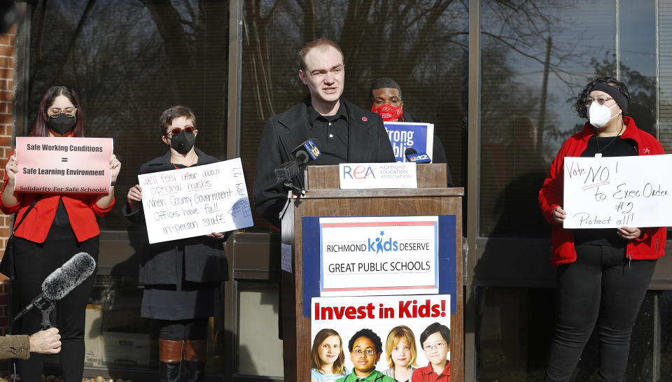 Patrick Miller, president of the Henrico Education Assoc., speaks about the health and safety of students and staff during the COVID-19 Omicron surge during a news conference outside the Richmond Education Assoc. office in Richmond, Va., Monday, Jan. 24, 2022. (Alexa Welch Edlund/Richmond Times-Dispatch via AP)
