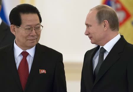 Russian President Vladimir Putin (R) and new North Korea's Ambassador Kim Hyun-joon attend a ceremony to hand over credentials at the Kremlin in Moscow, November 19, 2014. REUTERS/Alexander Zemlianichenko/Pool