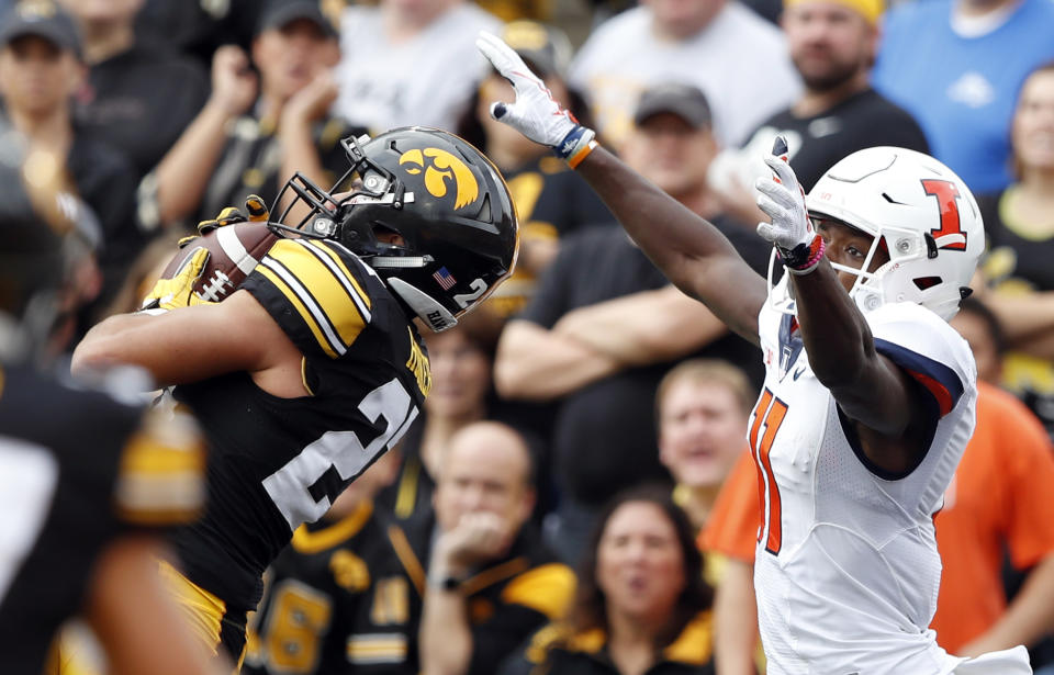 Iowa defensive back Amani Hooker intercepts a pass against Illinois (AP Photo)