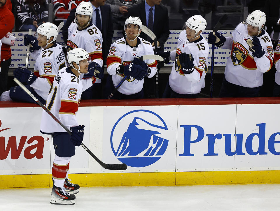 Florida Panthers center Nick Cousins (21) celebrates with teammates after scoring a goal against the New Jersey Devils during the third period of an NHL hockey game, Tuesday, March 5, 2024, in Newark, N.J. The Florida Panthers won 5-3. (AP Photo/Noah K. Murray)