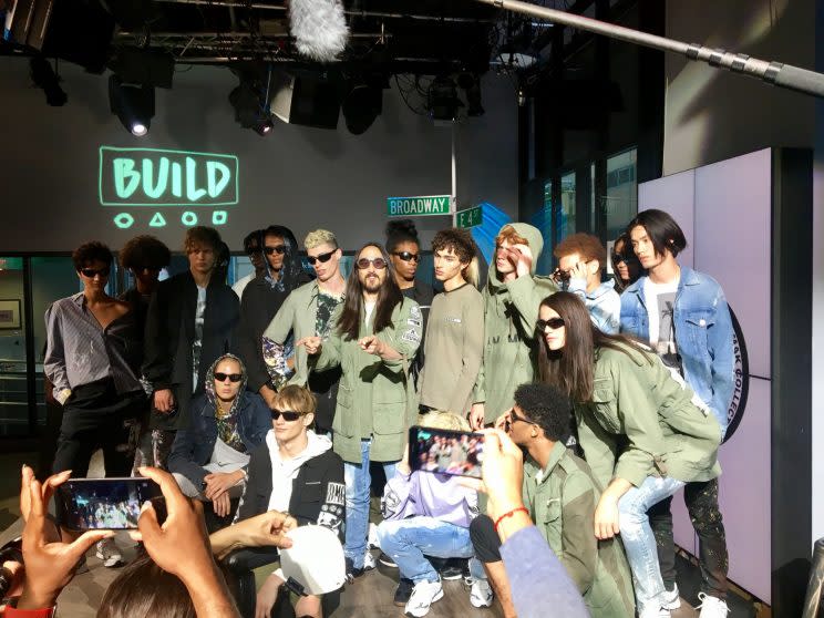 Steve Aoki poses with models before his Dim Mak Collection runway show. The clothes were Japan-meets-L.A. streetwear, with a touch of politics. (Photo: Yahoo Style)