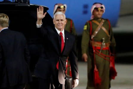 FILE PHOTO - U.S. Vice President Mike Pence waves to the media after his arrival at Amman military airport, Jordan, January 20, 2018. REUTERS/Muhammad Hamed