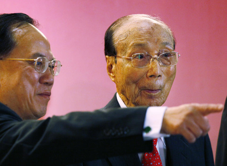 In this Tuesday, Sept, 28, 2010 photo, Hong Kong movie producer Run Run Shaw, right, poses with Hong Kong Chief Executive Donald Tsang during the Run Run Shaw prize presentation ceremony in Hong Kong. Pioneering Hong Kong movie producer Run Run Shaw has died at the age of 107. No cause of death was given in a statement from Television Broadcasts Limited (TVB), which Shaw helped found in 1967. (AP Photo/Kin Cheung)