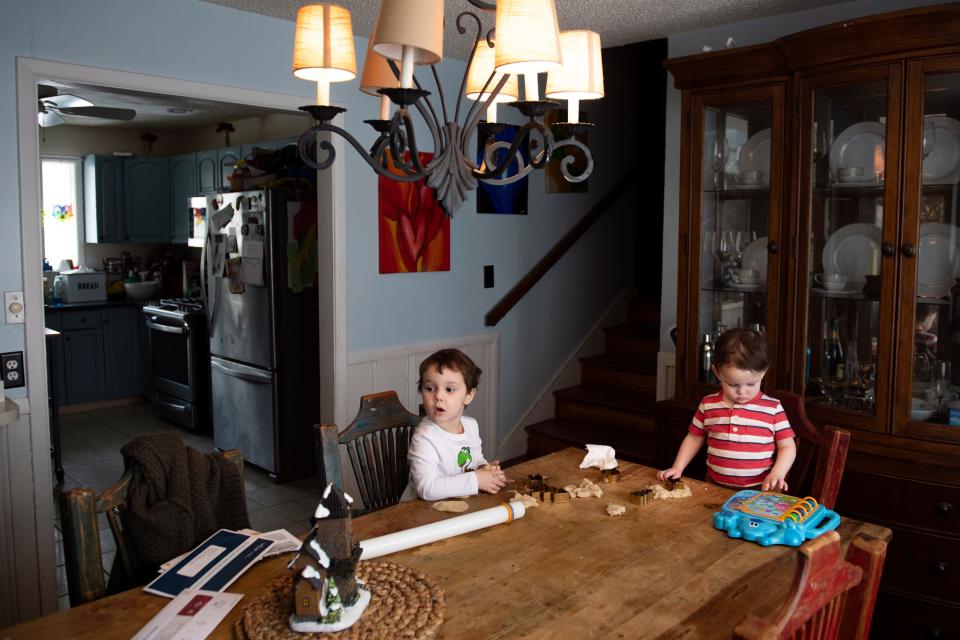 The Hart brothers, 3 year old at left and 1 year old at right, play in their dining room in Medford Lakes, NJ.