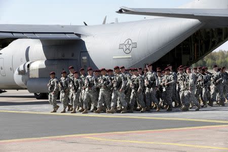 First company-sized contingent of about 150 U.S. paratroopers from the U.S. Army's 173rd Infantry Brigade Combat Team based in Italy arrive in the airport in Riga, Latvia, April 24, 2014. REUTERS/Ints Kalnins