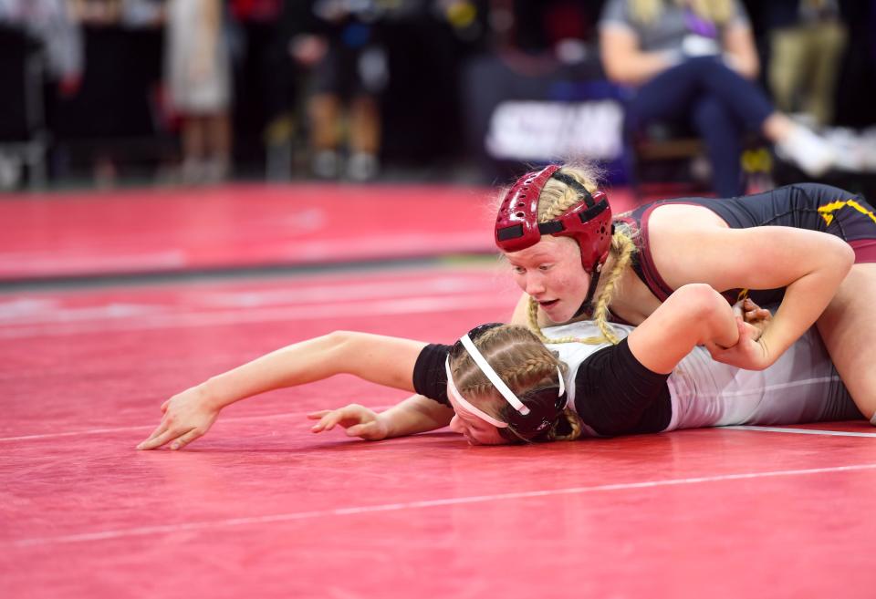 Harrisburg's Regina Stoeser attempts to pin Brandon Valley's Mary-Katherine Joseph during their championship match at the State Wrestling Tournament on Friday, February 25, 2022, at the Denny Sanford Premier Center in Sioux Falls.