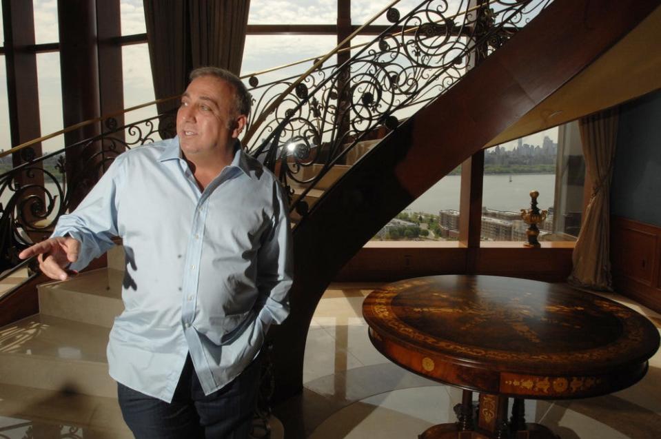 Fred Daibes, Edgewater-based developer, and largest shareholder in troubled Mariner's Bank, stands by the circular staircase  in his very large home within the St. Moritz in Edgewater in 2012.     Carmine Galasso/Staff Photographer.