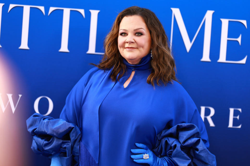 melissa mccarthy poses on a red carpet