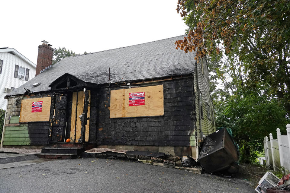 A home that was seriously damaged by fire is seen, Tuesday, Sept. 28, 2021, in Melrose, Mass. WBZ-TV reported that the $399,000 asking price for the home in Melrose, a suburb of Boston, is evidence of how hot the housing market is in the state. The online listing for the burned, three bedroom, 1,857-square foot home says it is in need of complete renovation and is being sold as is. (AP Photo/Elise Amendola)