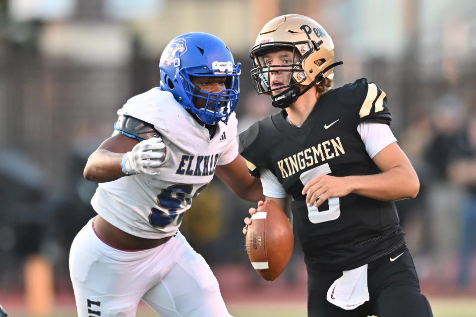 Elkhart’s Mariyon Dye (99) sacks Penn quarterback Nolan McCullough (6) in the second quarter Friday, Sept. 15, 2023, at Freed Field.