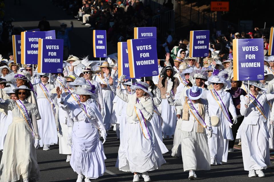 Women dressed as suffragists celebrate the 100th anniversary of the 19th amendment during the 131st Rose Parade in Pasadena, California, on January 1, 2020. (Photo by Robyn Beck / AFP) 