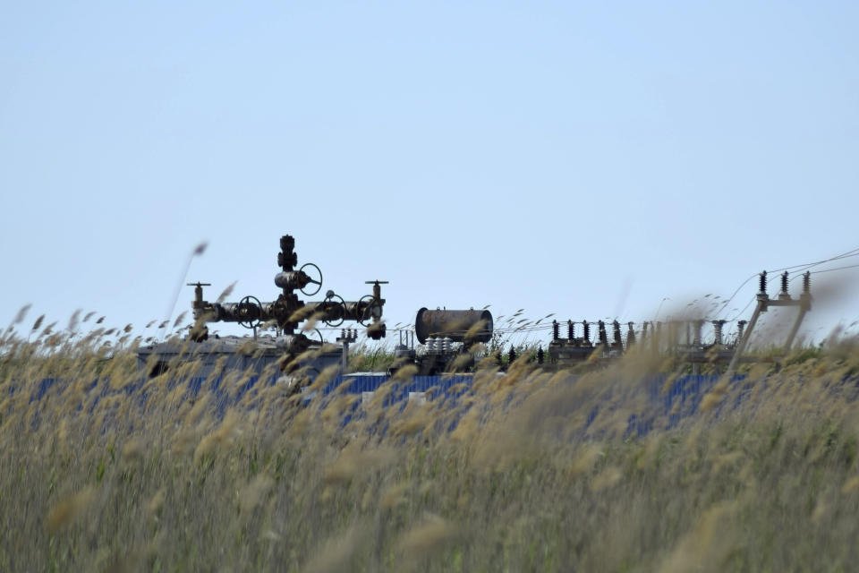 An oil and gas well in a field.