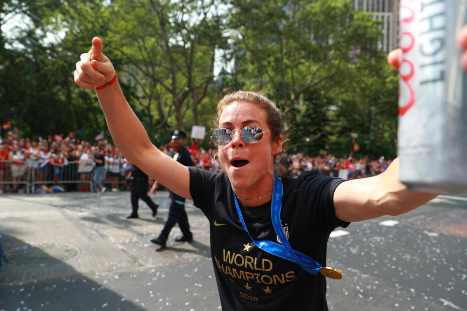 Kelley O'Hara of the U.S. women's soccer team celebrates with fans during a parade along the Canyon of Heroes, July 10, 2019, in New York. (Photo: Gordon Donovan/Yahoo News)
