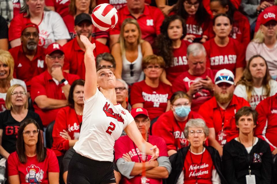 Nebraska setter Bergen Reilly serves against Wisconsin.