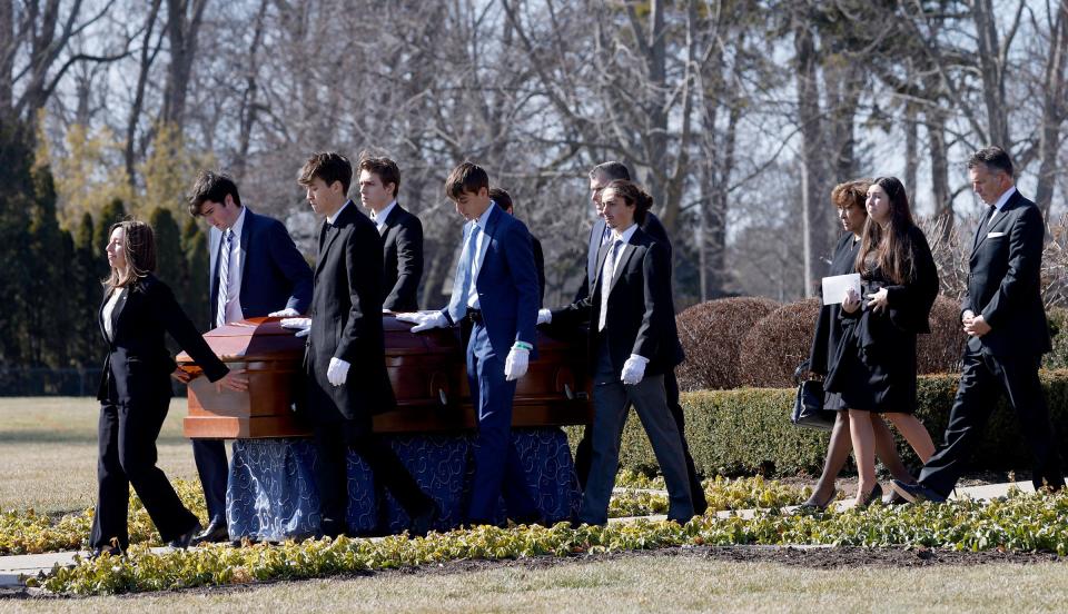 The family of Brian Fraser follows the casket toward the hearse after the funeral service at St. Paul on the Lake Catholic Church in Grosse Pointe Farms on Saturday, Feb. 18, 2023. Fraser was one of three Michigan State University students shot and killed by a gunman on campus on Monday, Feb. 13, 2023.