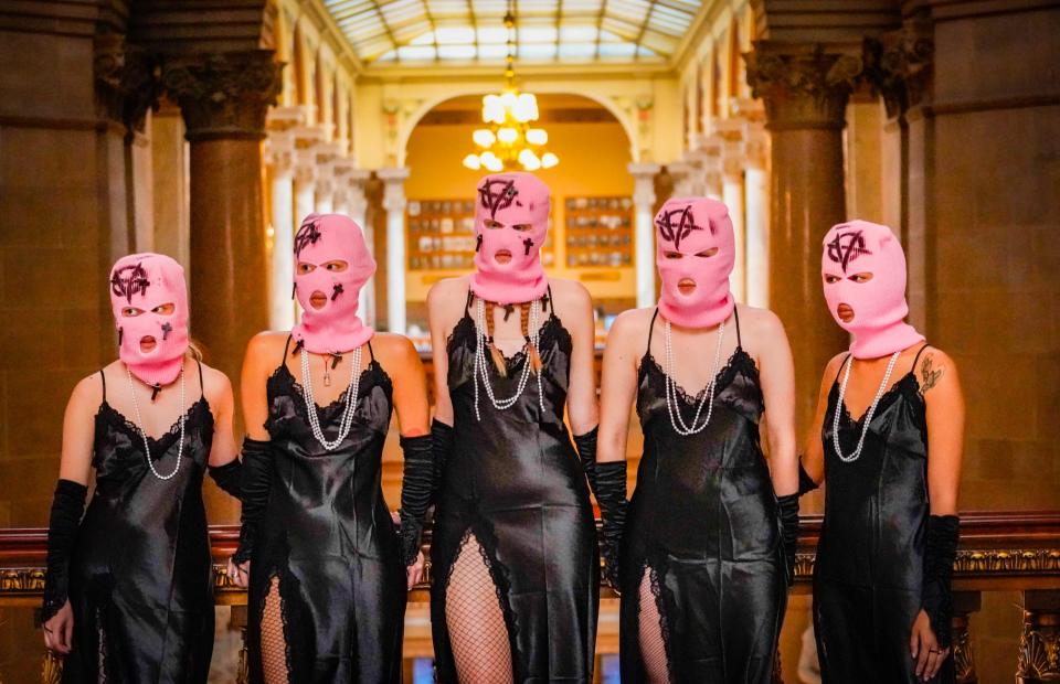 Pussy Riot performs a political protest action outside the Indiana Statehouse on Tuesday, Nov.14, 2023, in Indianapolis.