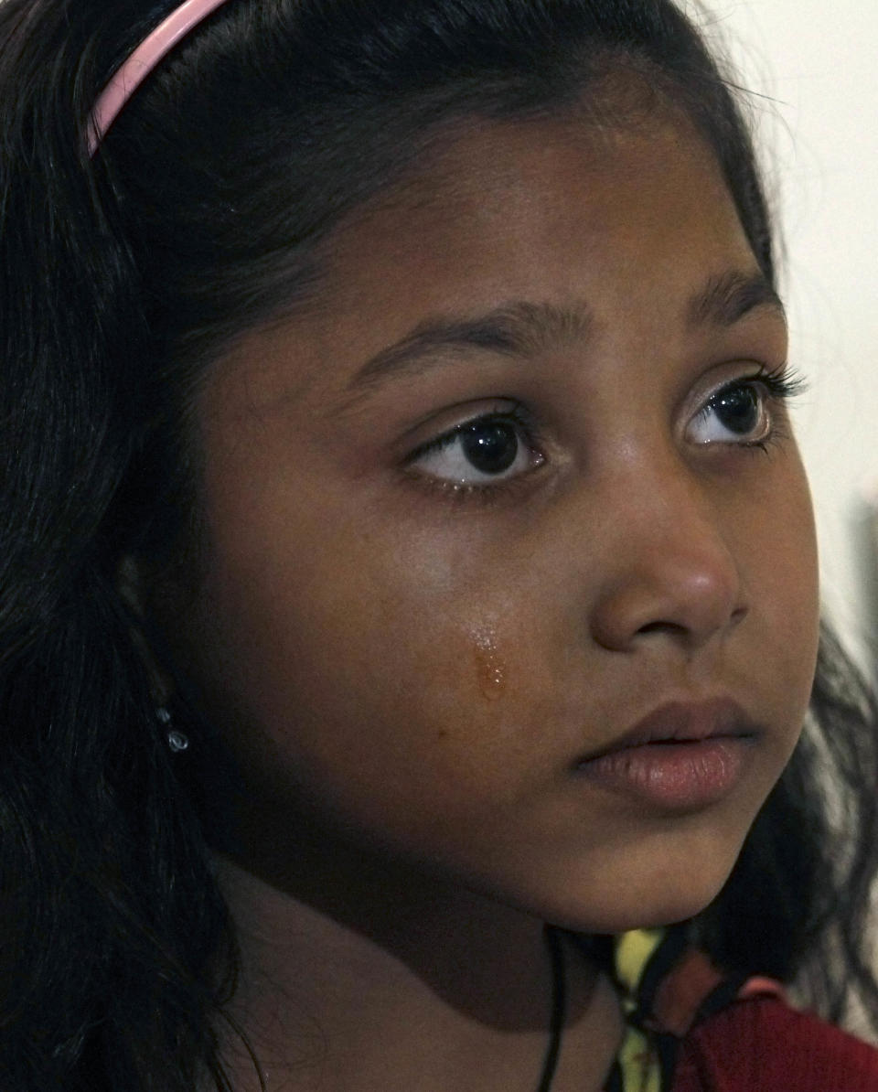 In this Friday, Jan. 10, 2014 photo, Pakistani Christian girl, Zaira, 6, whose mother and father were arrested on charges of sending text messages that insulted Islam's Prophet, cries during an interview with The Associated Press, in Lahore. Pakistan’s blasphemy law has become a potent weapon in the arsenal of Muslim extremists, who use it against adherents of minority religions. (AP Photo/Anjum Naveed)