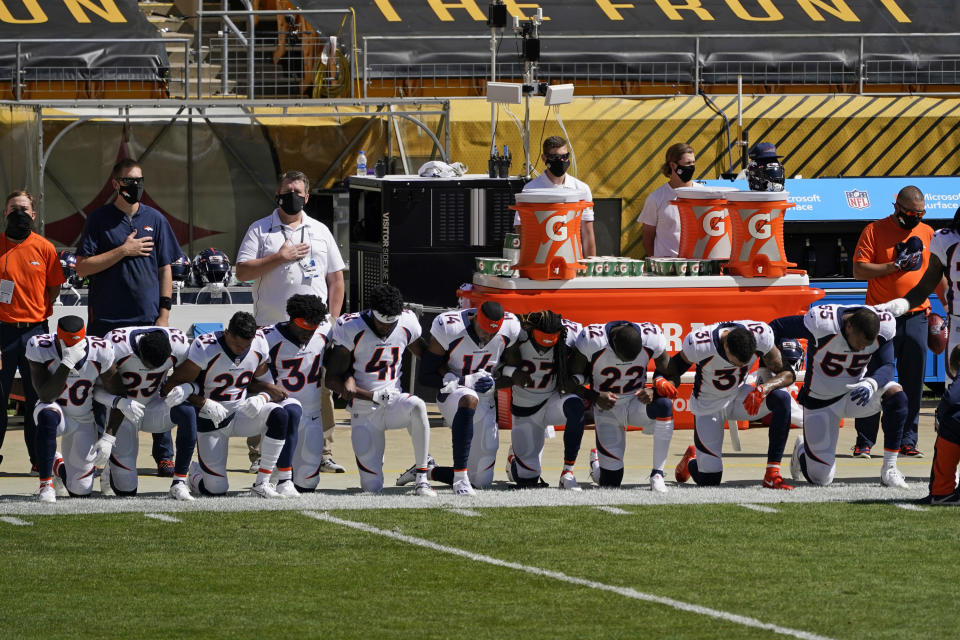 Members of the Denver Broncos kneel during the national anthem before an NFL football game against the Pittsburgh Steelers, Sunday, Sept. 20, 2020, in Pittsburgh. (AP Photo/Keith Srakocic)