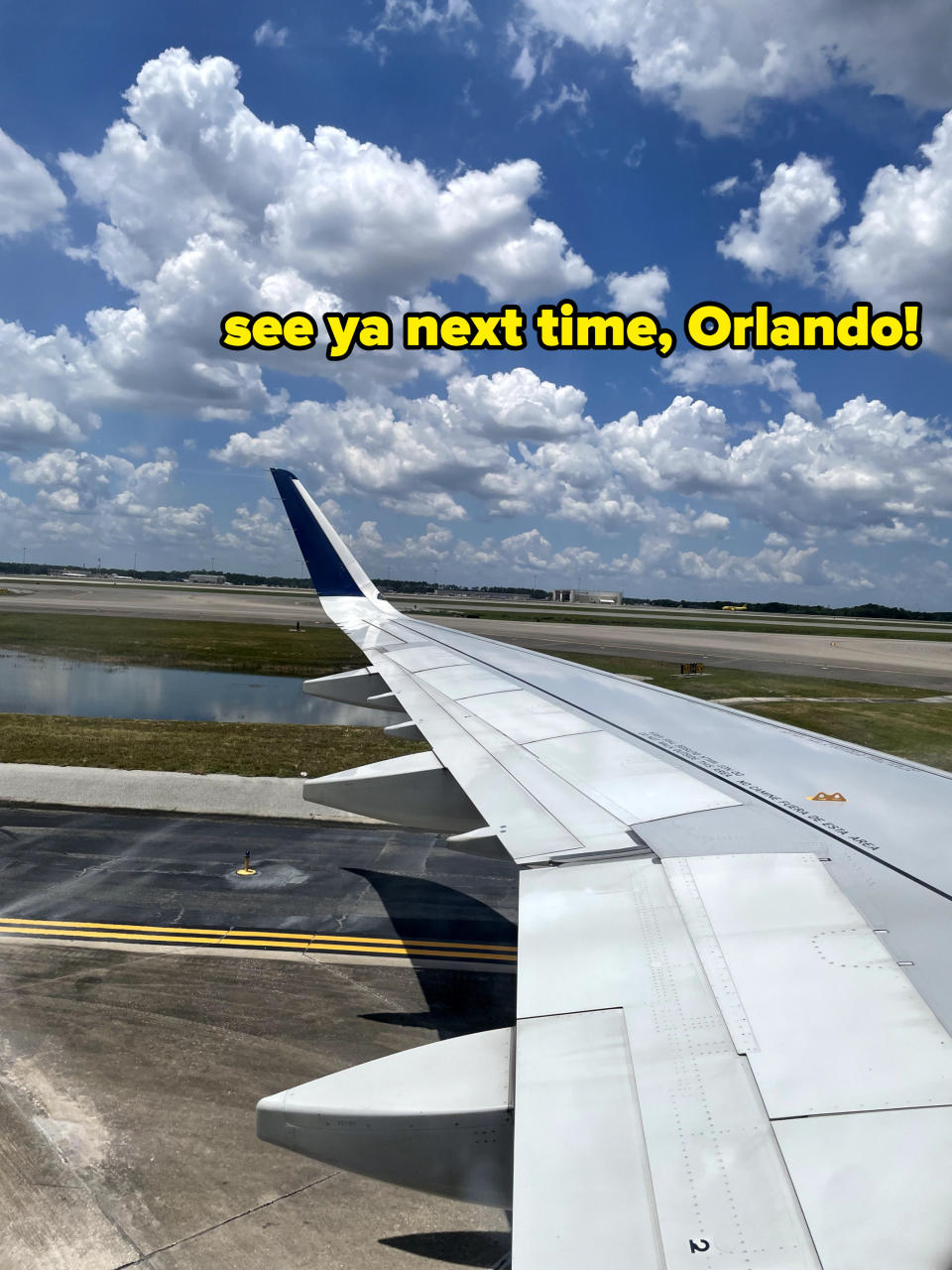 plane wing with the words "See you next time, Orlando"