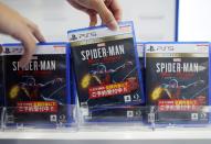 The logos of Sony PlayStation 5 are seen on the packaging of its gaming software in Tokyo