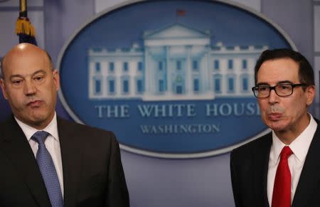 U.S. National Economic Director Gary Cohn (L) and Treasury Secretary Steven Mnuchin react to questions while unveiling the Trump administration's tax reform proposal in the White House briefing room in Washington, U.S, April 26, 2017. REUTERS/Carlos Barria