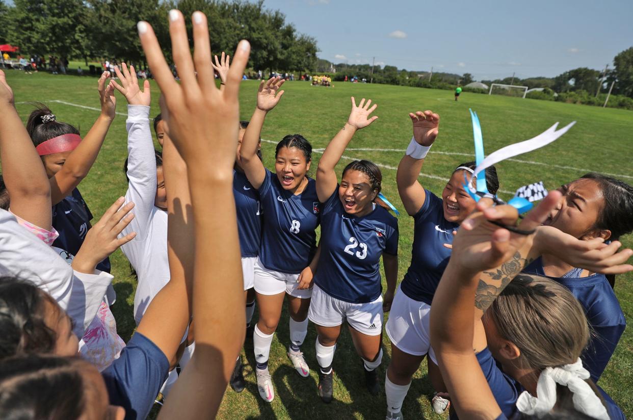 North Hill is Akron's only growing neighborhood. The growth is driven by immigration and refugees, including many from the Bhutanese community. Here, the Mountaineers Football Club team gets pumped up before their game against Rajababu FC during the Bhutanese soccer event in 2021