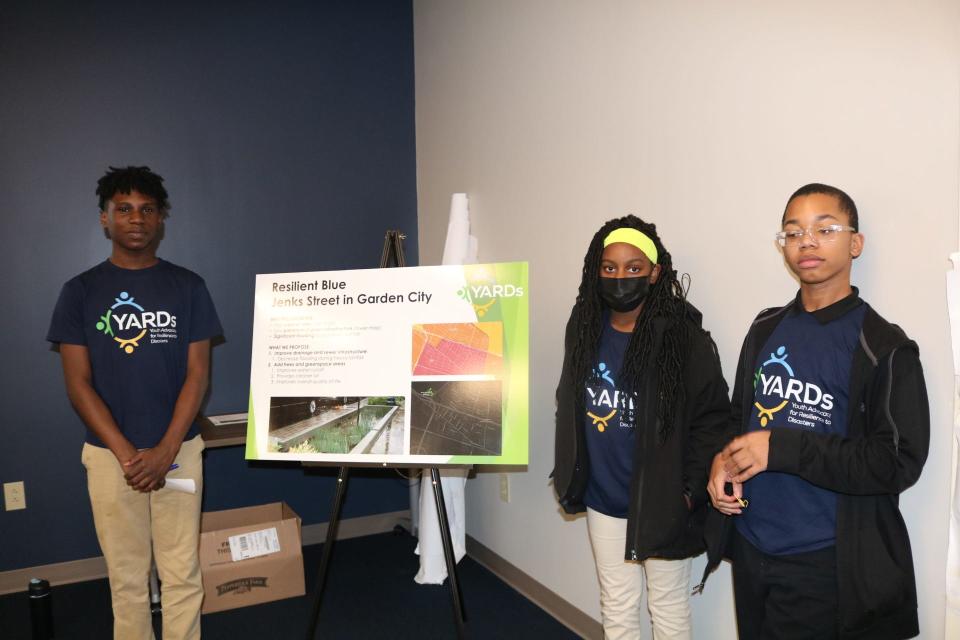 Mercer Middle School students present plans to reduce flooding along Jenks Street.