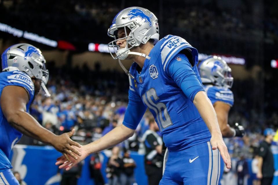 Lions quarterback Jared Goff high-fives teammates during warmups before the NFC wild-card game at Ford Field on Sunday, Jan, 14, 2024.