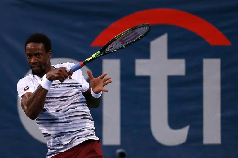 Gael Monfils of France returns a shot to Borna Coric of Croatia during their match on day four of the Citi Open, at Rock Creek Tennis Center in Washington, DC, on July 21, 2016