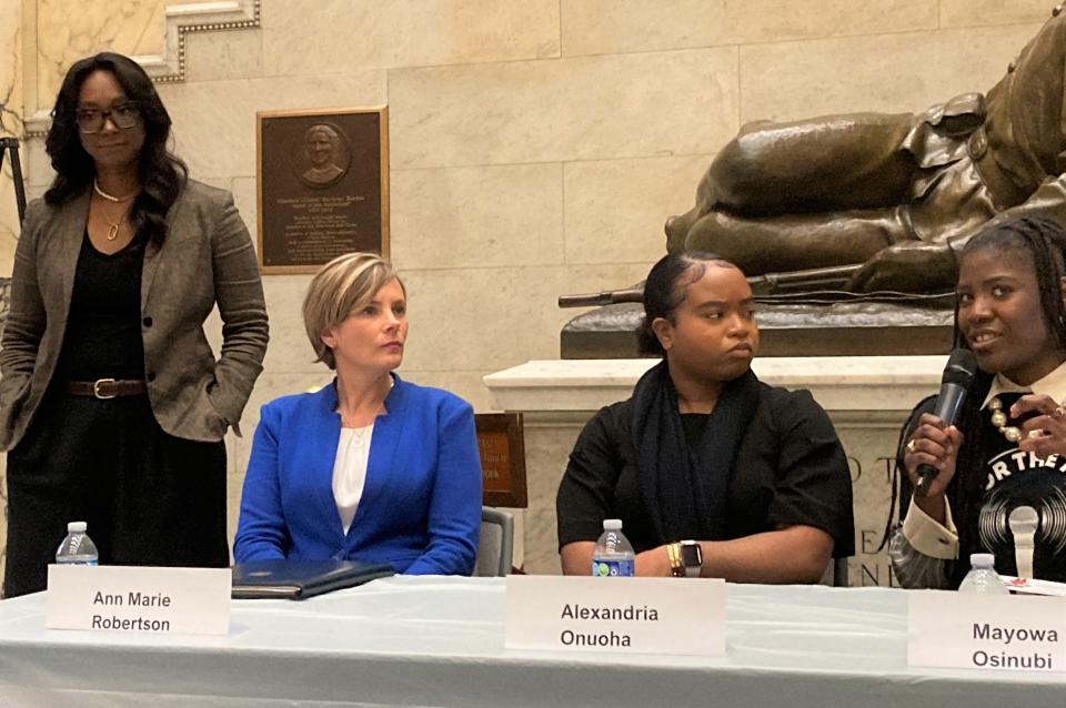 From left, Crystal Hayes of Basic Black GBH, State Police Det. Lt. Ann Marie Robertson, Alexandria Onuoha, a doctoral student at Suffolk University, and Mayowa Osinubi, co-founder of Mics for the Missing, attend a legislative briefing Wednesday in Nurses Hall.