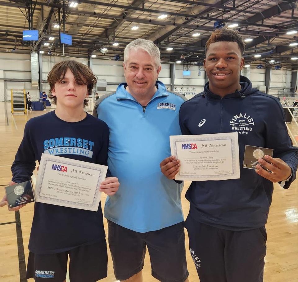 Jake Austin and Kendrick Hodge of Somerset Academy-Pembroke Pines wrestling earned All American honors. They are pictured with Coach Joe Blasucci.