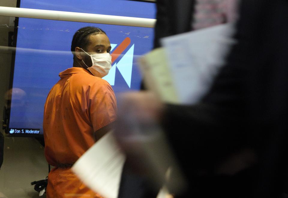 Jamaal Mellish watches as attorneys leave the courtroom following a hearing in state Superior Court in Sussex County on Friday, Feb. 22, 2022.