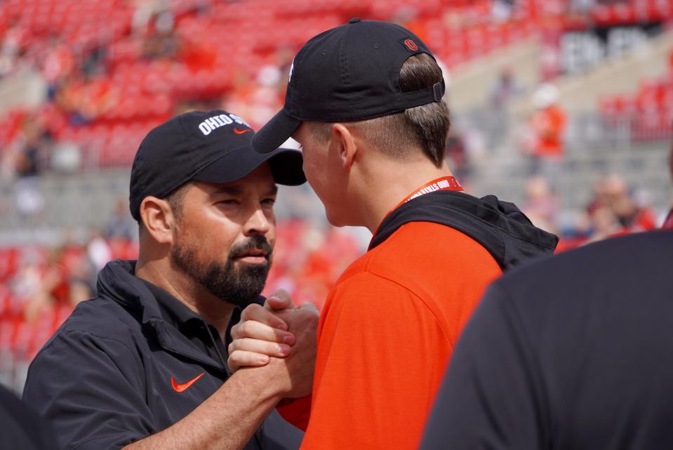 Nate Roberts, a 2025 tight end prospect out of Washington, Oklahoma, speaks with OSU coach Ryan Day prior to the Buckeyes' game against Western Kentucky on Sept. 16, 2023.