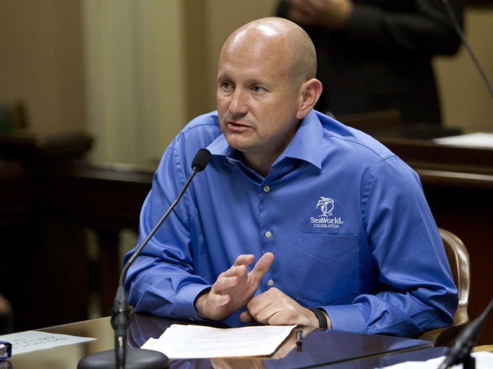 Sea World San Diego President John Reilly testifies about a bill by Assemblyman Richard Bloom, D-Santa Monica, that would set new guidelines for treatment of killer whales in captivity before the Assembly Water, Parks and Wildlife Committee at the Capitol in Sacramento, Calif., on Tuesday, April 8, 2014.(AP Photo/Steve Yeater)