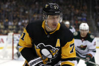 Pittsburgh Penguins' Evgeni Malkin (71) skates into the corner after the puck during the second period of the team's NHL hockey game against the Minnesota Wild in Pittsburgh, Tuesday, Jan. 14, 2020. (AP Photo/Gene J. Puskar)