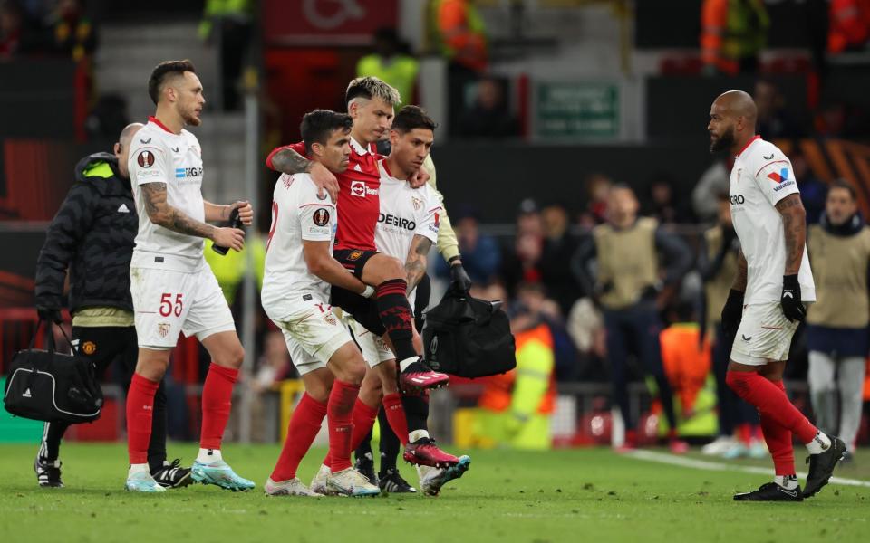 Martinez is carried off by his Argentinian team-mates - Getty Images/Matthew Ashton