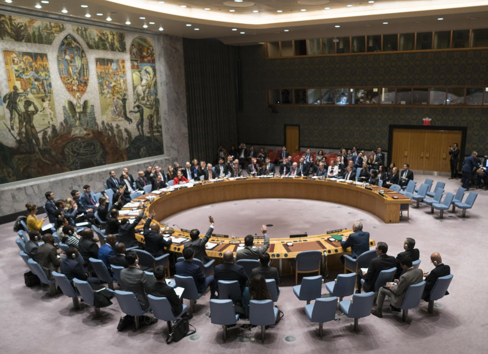 FILE - In this Saturday, Feb. 24, 2018, file photo, members of the United Nations Security Council vote on a resolution at United Nations headquarters. U.S. President Donald Trump is set to chair a U.N. Security Council meeting for the first time, on Wednesday, Sept. 26, 2018. The meeting will put the “America First” president around a table with representatives from countries with fraught relationships with the U.S., including Russia and China. (AP Photo/Craig Ruttle, File)