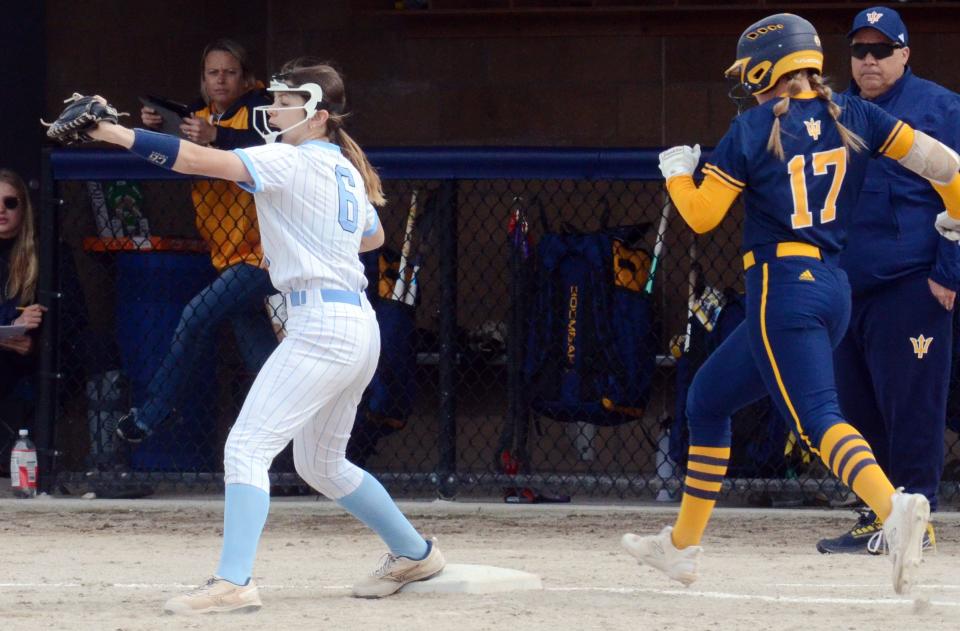 Petoskey's Jaidyn Ecker squeezes an out at first base before Gaylord's Jayden Jones can reach the bag during Friday's matchup.