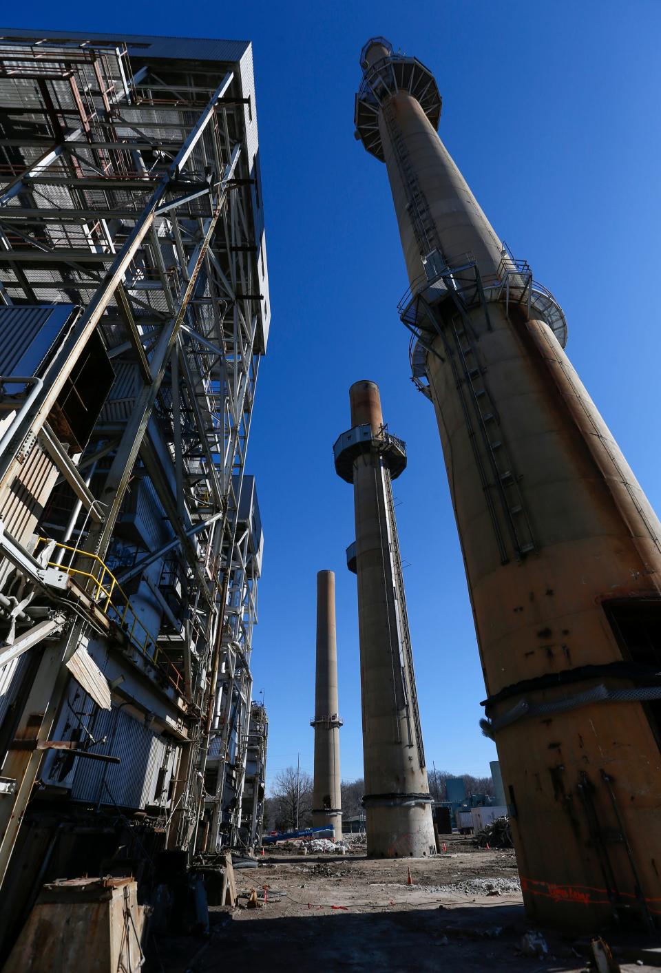 Construction crews demolish equipment at the James River Power Station on Monday, Jan. 31, 2022. The smokestacks at the decommissioned power plant are set to be imploded later this month. 