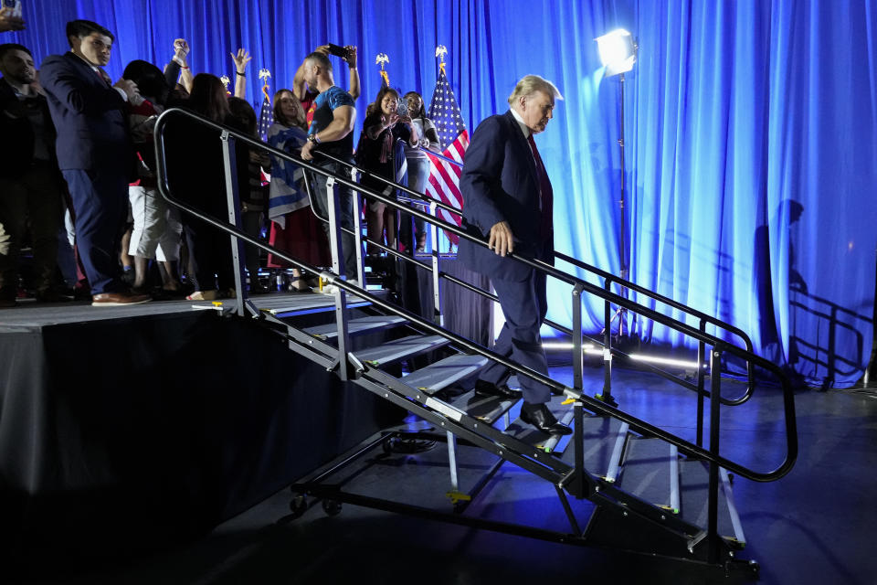 Republican presidential candidate former President Donald Trump walks from the stage after speaking at his birthday celebration, hosted by Club 47, in West Palm Beach, Fla., Friday, June 14, 2024. (AP Photo/Gerald Herbert)