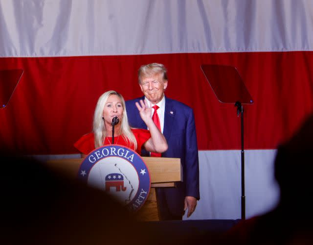 COLUMBUS, GEORGIA – JUNE 10: Former U.S. President Donald Trump looks on as Rep. Marjorie Taylor Greene (R-GA) speaks during his remarks at the Georgia state GOP convention at the Columbus Convention and Trade Center on June 10, 2023 in Columbus, Georgia. On Friday, former President Trump was indicted by a federal grand jury on 37 felony counts in Special Counsel Jack Smith’s classified documents probe. (Photo by Anna Moneymaker/Getty Images)