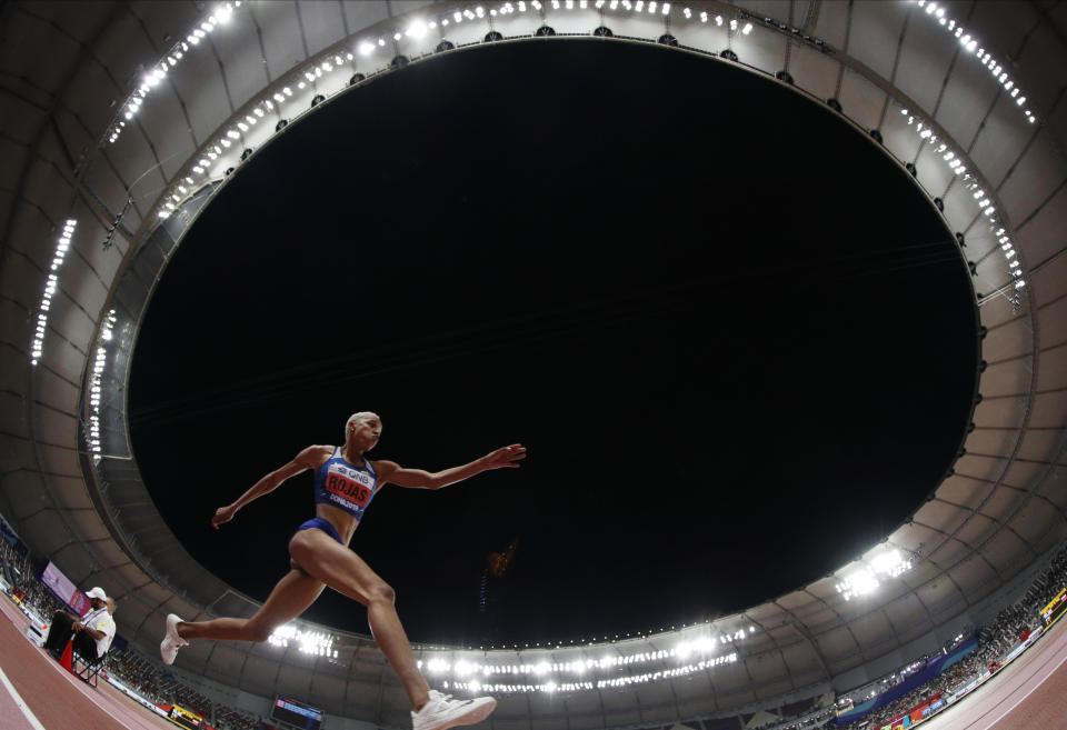 Gold medalist triple jump winner Yulimar Rojas, of Venezuela, competes at the World Athletics Championships in Doha, Qatar, Saturday, Oct. 5, 2019. (AP Photo/Hassan Ammar)