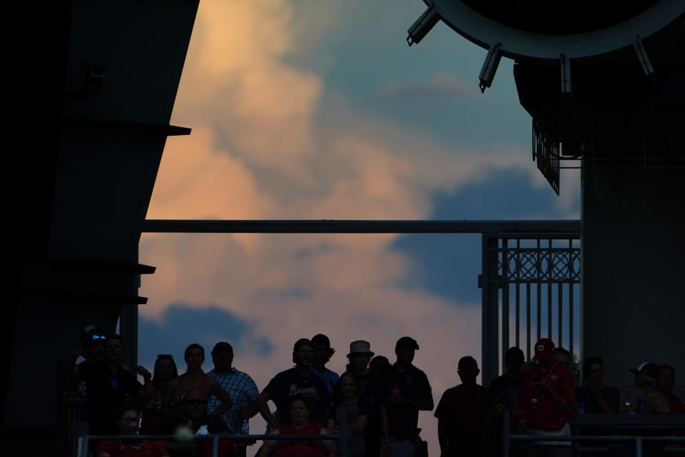 Baseball fans watch the game from center field during the fifth inning of a baseball game between the Atlanta Braves and the Cincinnati Reds, Friday, July 1, 2022, at Great American Ball Park in Cincinnati. The Atlanta Braves won, 9-1. 