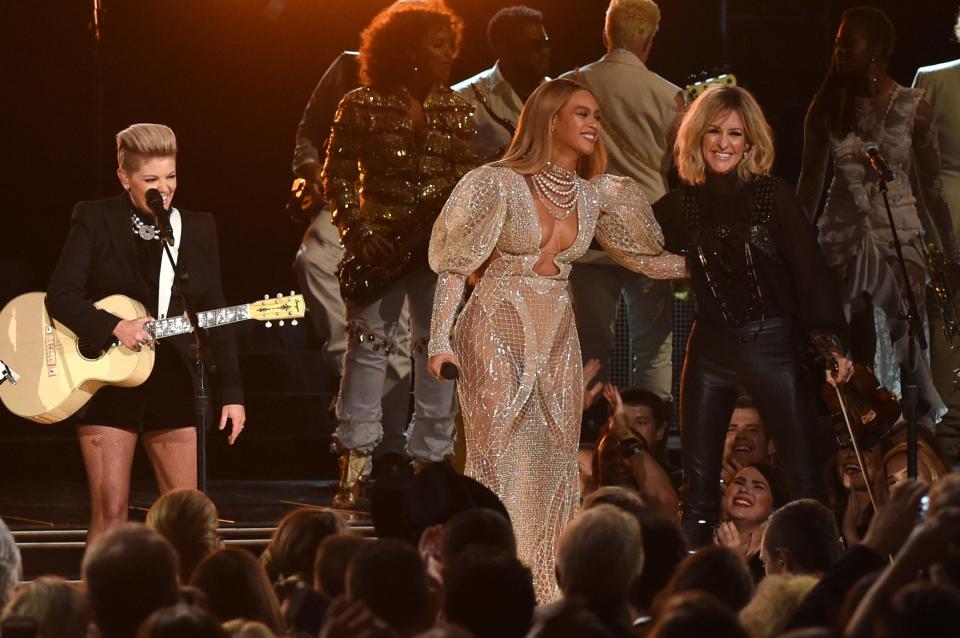 Beyonce performs onstage with Martie Maguire of the Dixie Chicks at the 50th annual CMA Awards at the Bridgestone Arena on November 2, 2016; in Nashville, Tennessee.