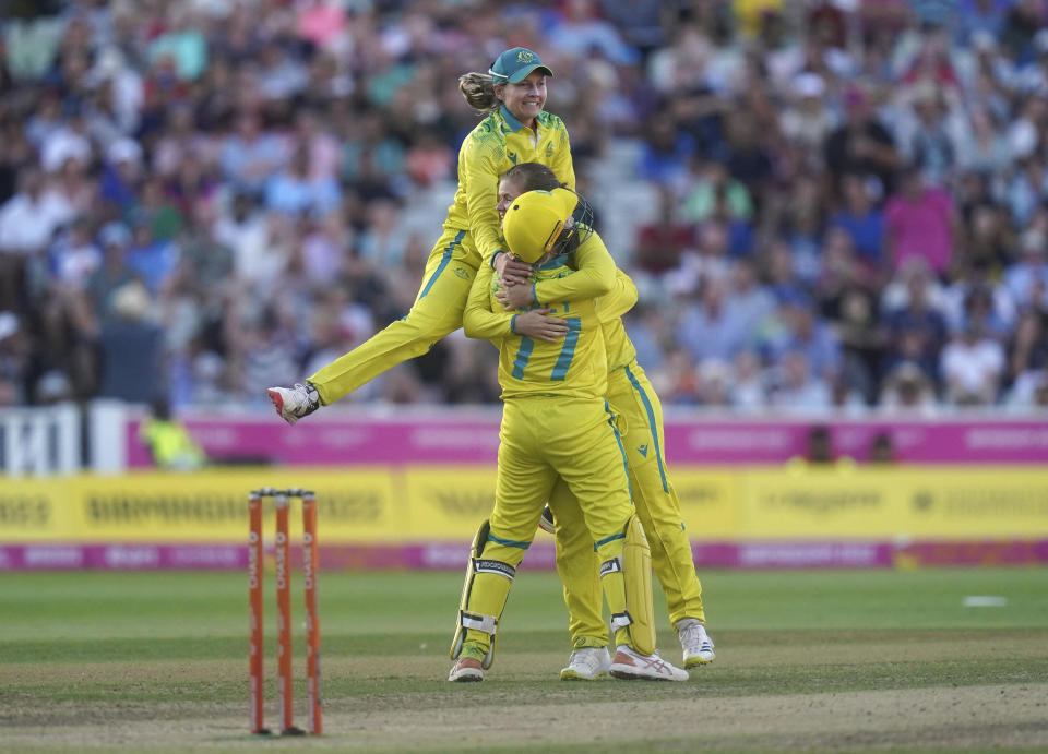 Australia players celebrate winning the gold medal in the cricket final after defeating India at Edgbaston Stadium on day ten of 2022 Commonwealth Games in Birmingham, England, Sunday Aug. 7, 2022. (Adam Davy/PA via AP)