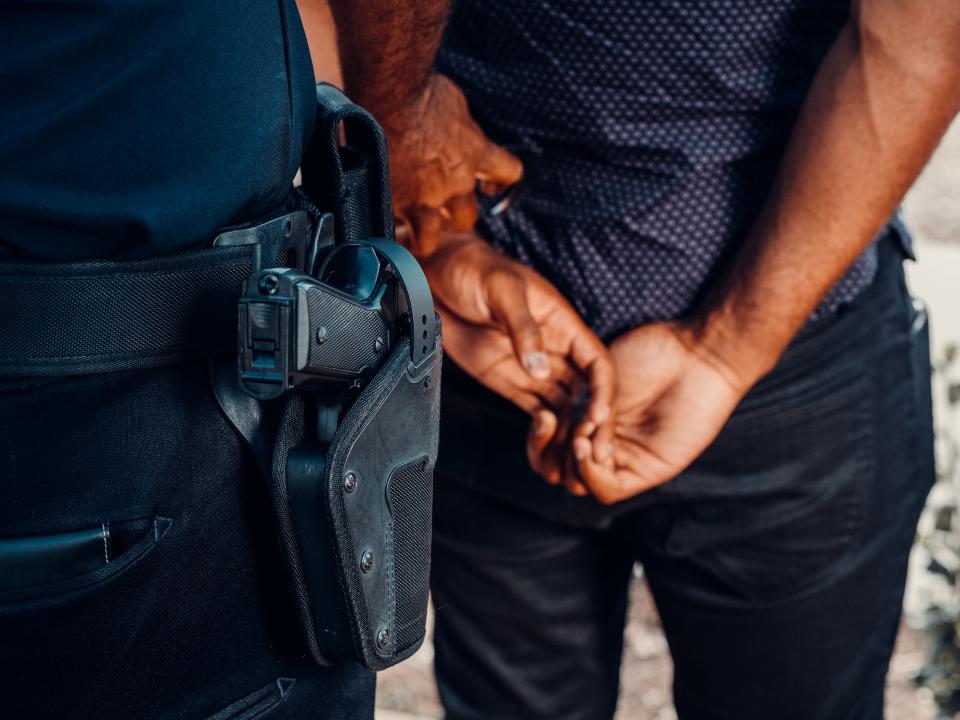 A police officer makes an arrest.