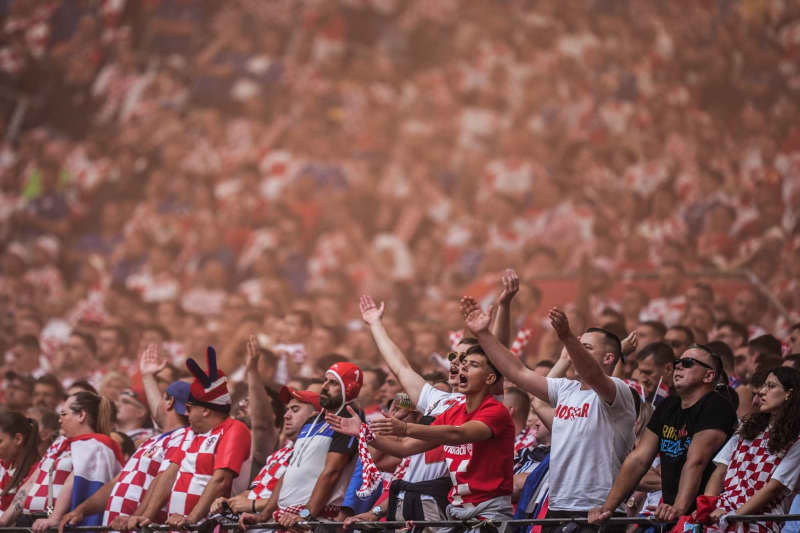 Croatia fans cheer in the stands during the UEFA Euro 2024 group B soccer match between Croatia and Albania at Volksparkstadion Hamburg. Marcus Brandt/dpa