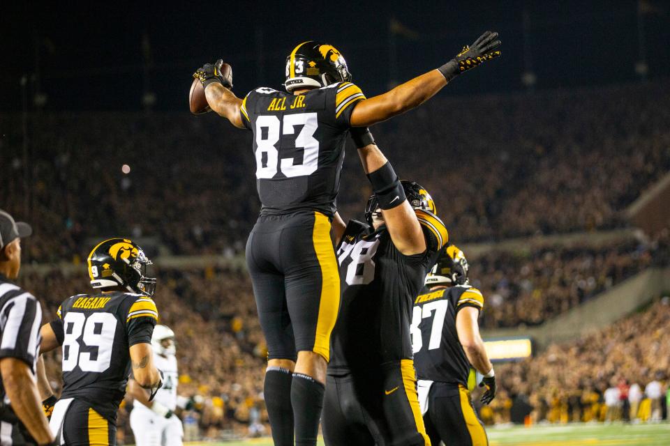 Iowa Hawkeyes tight end Erick All (83) is lifted after his touchdown against Michigan State during an NCAA college football game Saturday, Sept. 30, 2023, in Iowa City, Iowa. (Geoff Stellfox/The Gazette via AP)