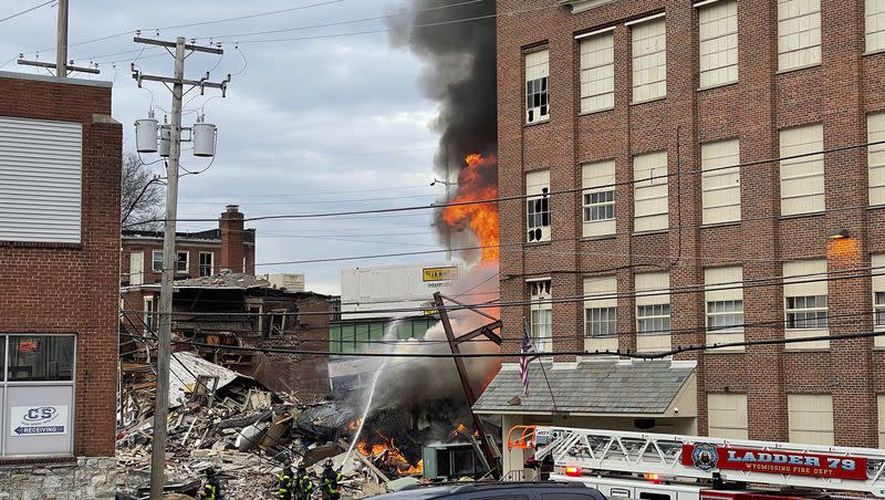 Emergency personnel work at the site of a deadly explosion at a chocolate factory in West Reading, Pa., Friday, March 24, 2023.